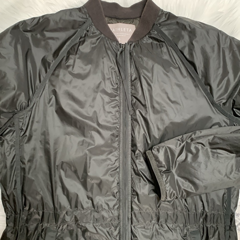 Athleta light weight insulated knee length wind and rain coat.